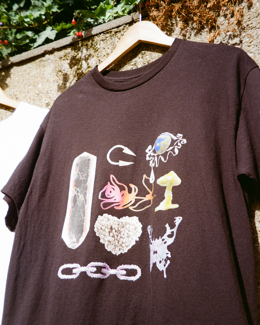 Black t-shirt with a crystal, mushroom, and butterfly