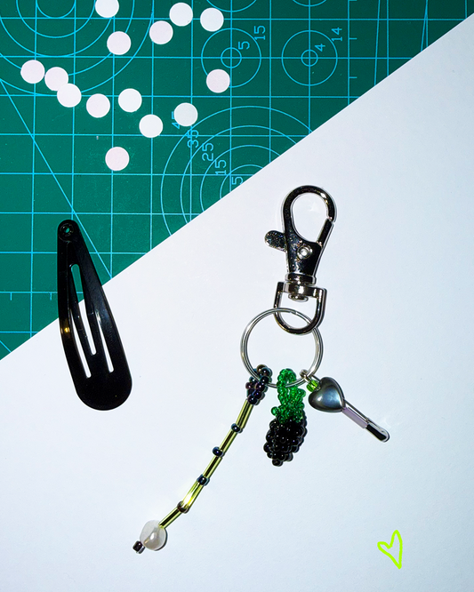 Blackberry keychain with a pin and a small black mother-of-pearl heart