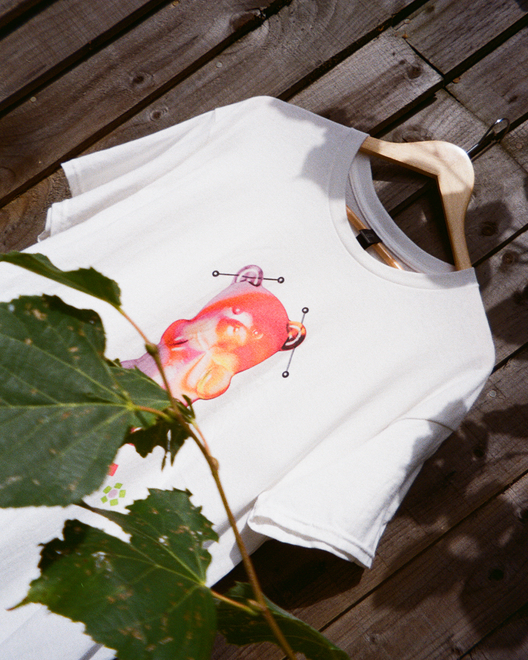 White t-shirt with a gummy bear and beaded flowers