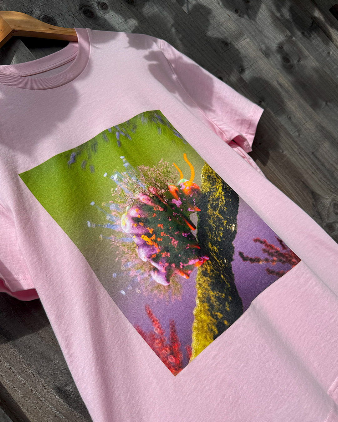 Pink t-shirt with a cute flower caterpillar