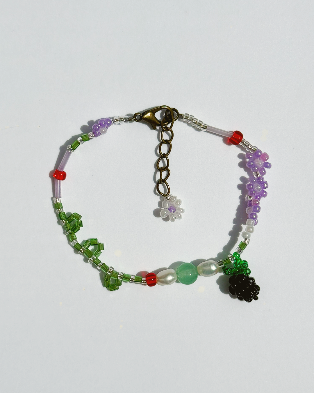 Beaded bracelet with colorful beads on a white background
