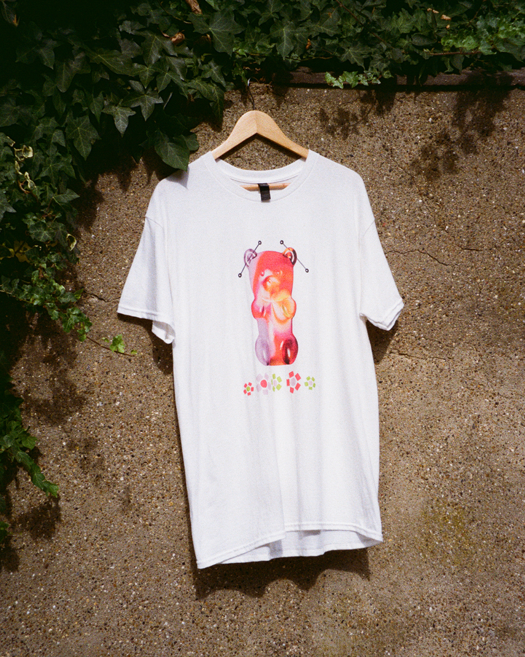 White t-shirt with a gummy bear and beaded flowers