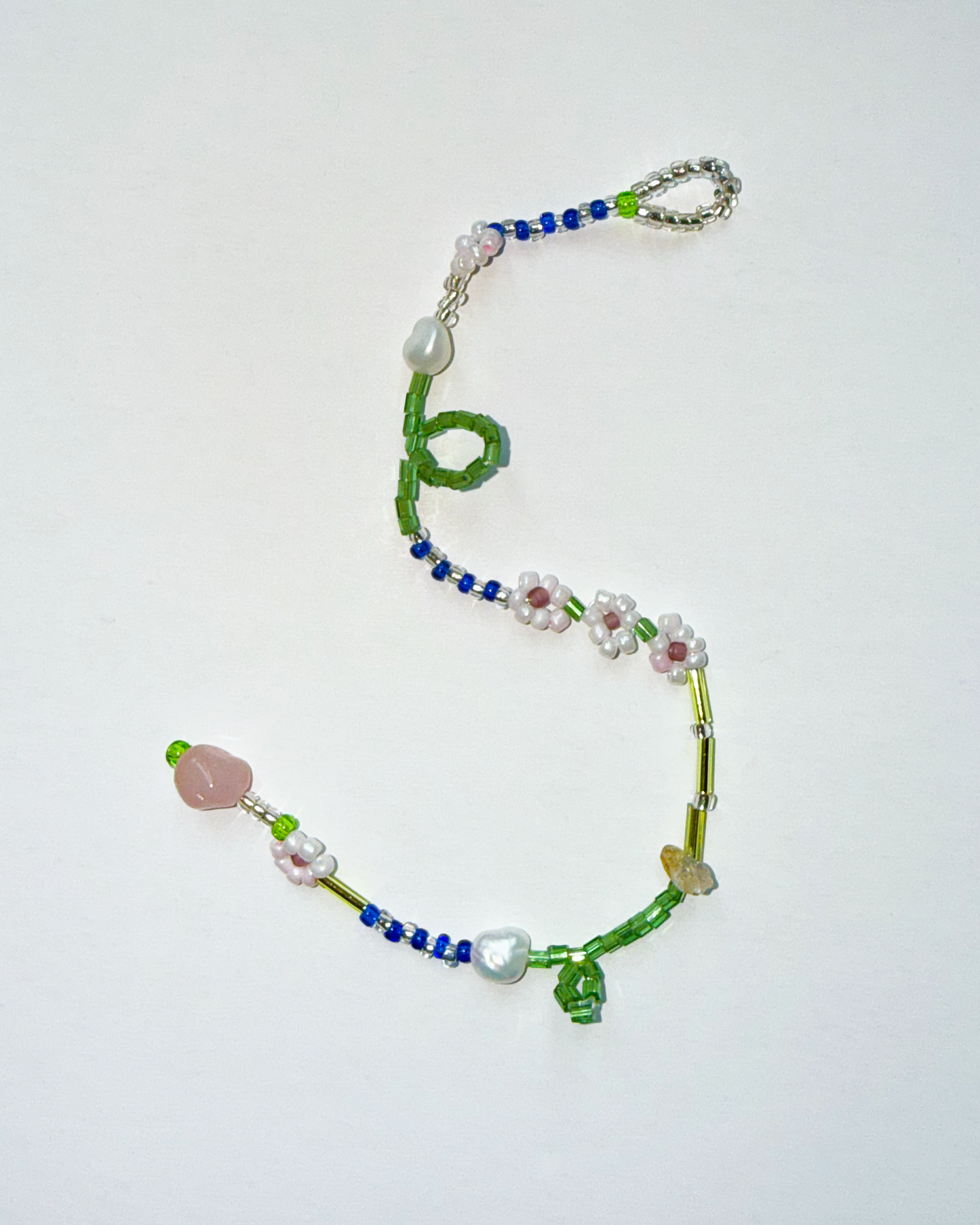 Colorful beaded bracelet on a white background