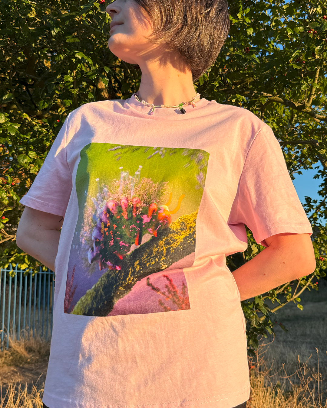 Pink t-shirt with a cute flower caterpillar