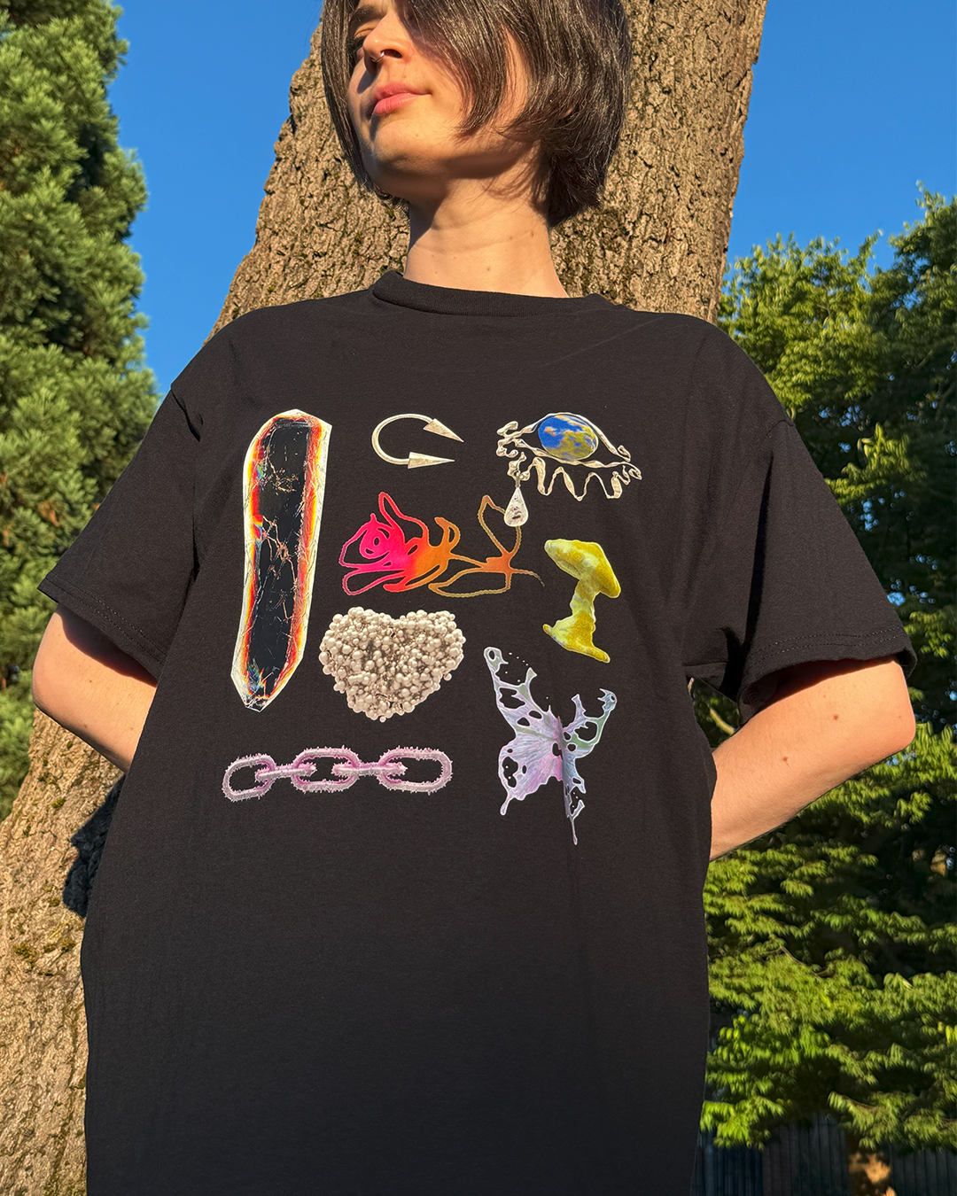 Black t-shirt with a crystal, mushroom, and butterfly
