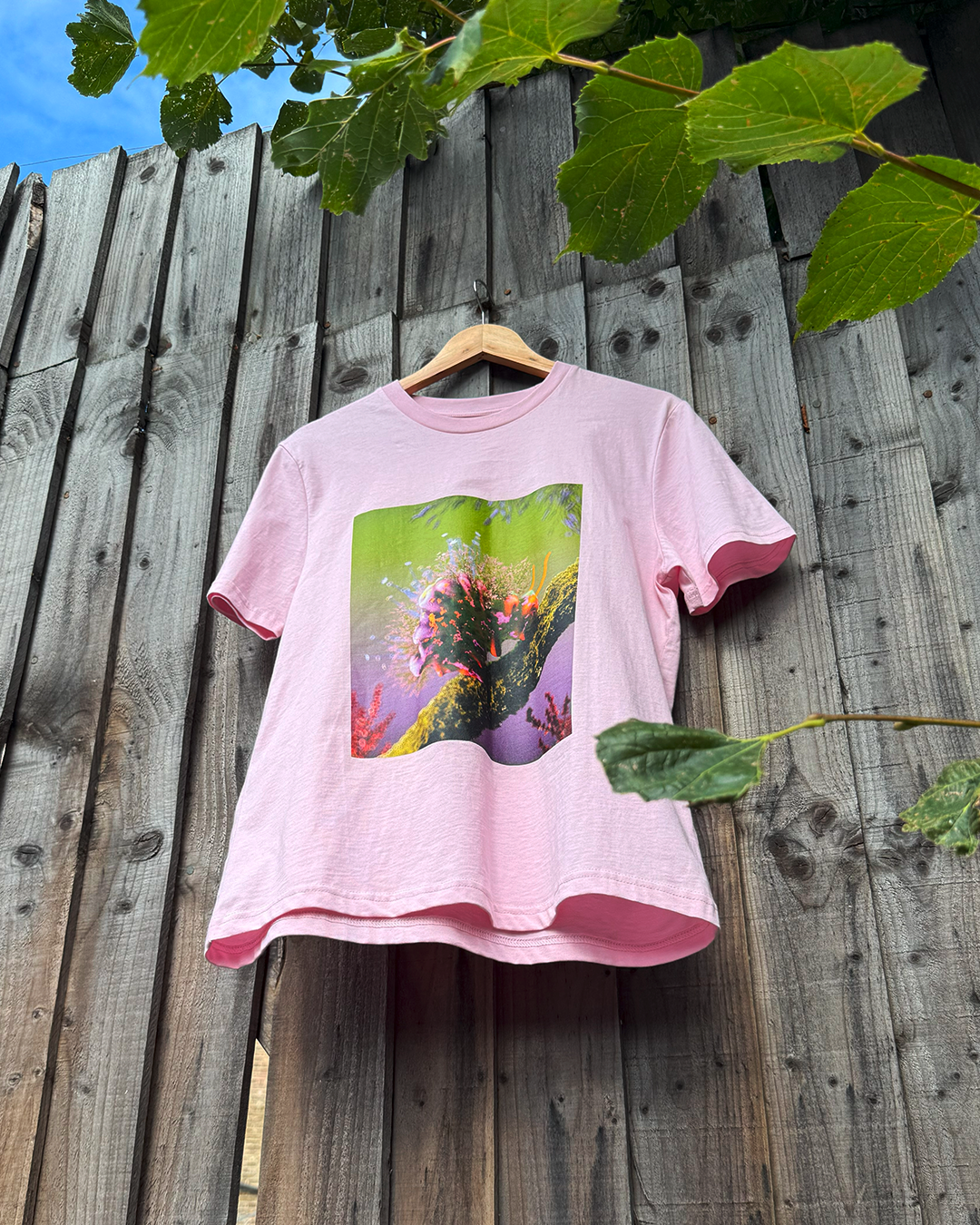 Pink t-shirt with a cute flower caterpillar