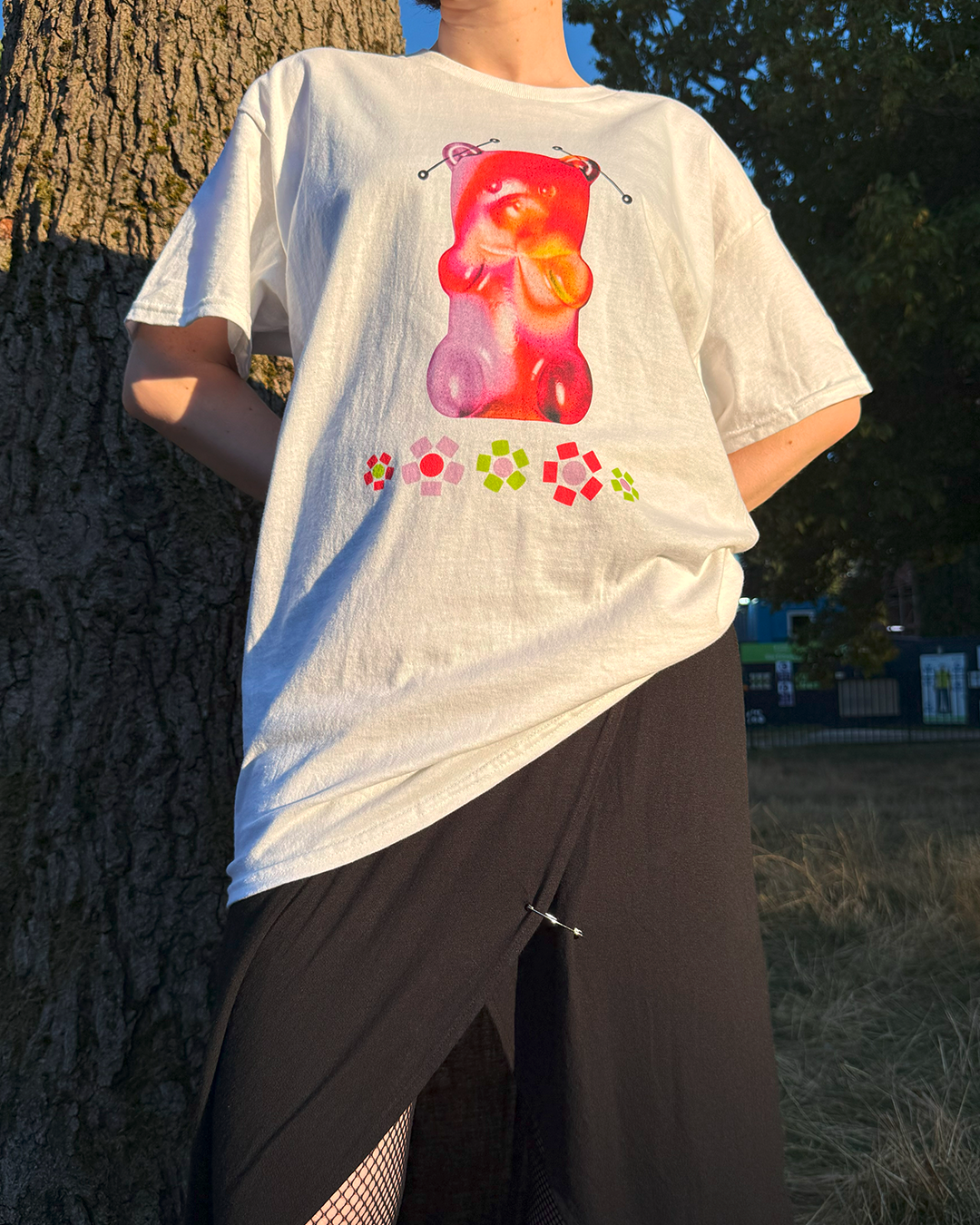 White t-shirt with a gummy bear and beaded flowers