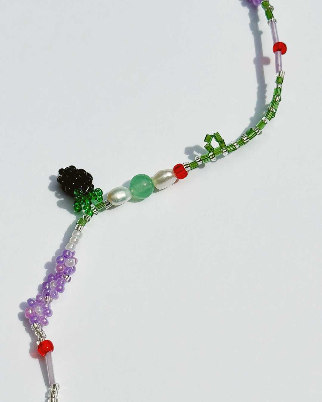 Colorful beaded bracelet on a white background