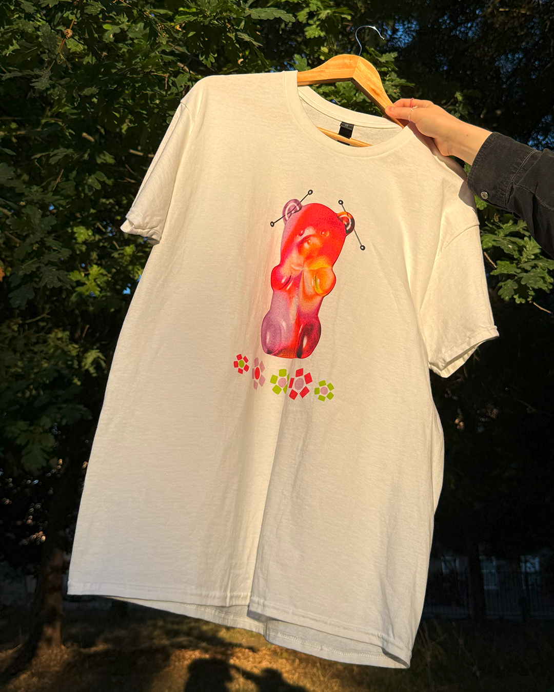 White t-shirt with a gummy bear and beaded flowers