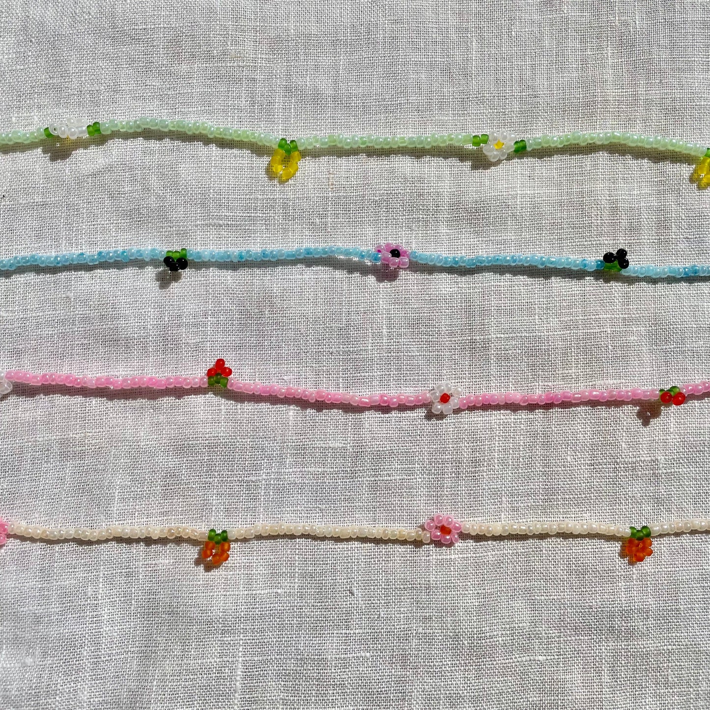 Embroidered floral patterns on a textured fabric background