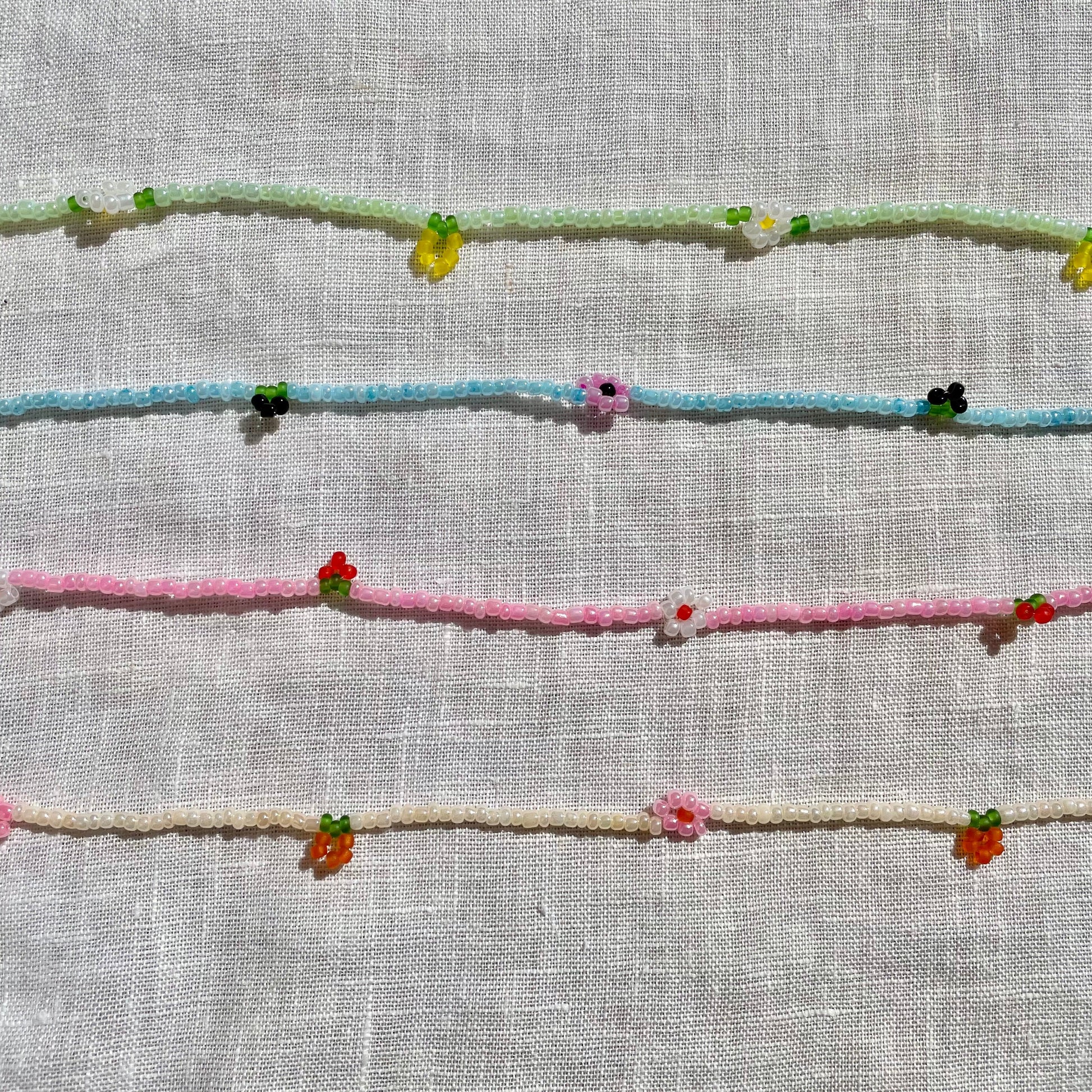 Embroidered floral patterns on a textured fabric background